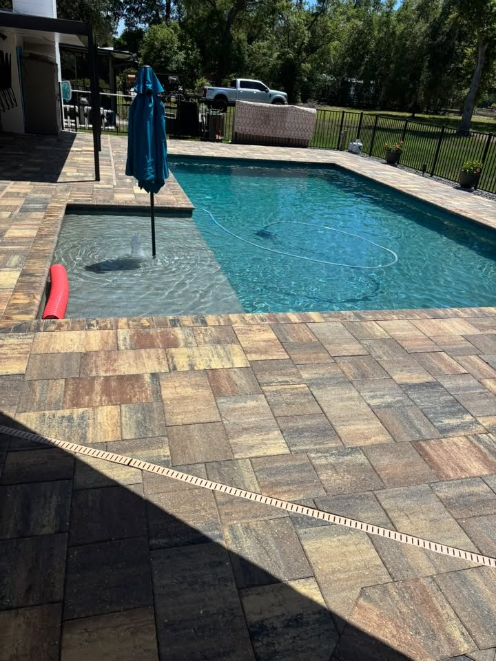 Pristine pool deck pavers cleaned by Gulfstream